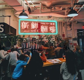 People in Room Sitting on Chair