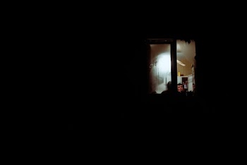 People Inside A Room With Black Background