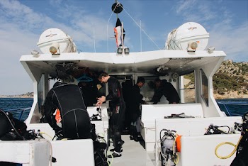 People Inside White Boat