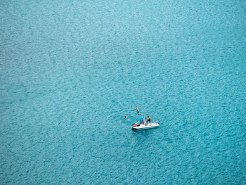 people jumping on boat