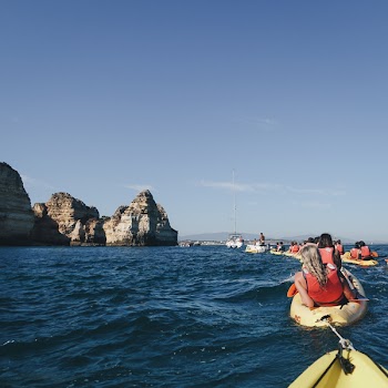 People Kayaking During Day