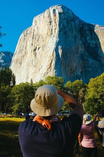 People Looking at Rock