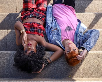 People Lying on Concrete Stairs