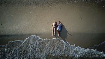 People Lying on Shore