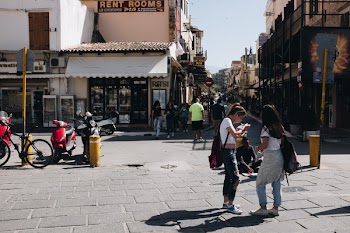 People Near a Brown Building at Daytime