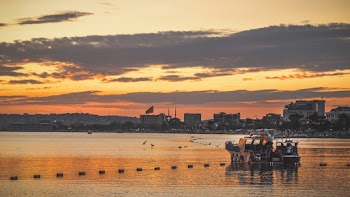 People on Boat on Water during Golden Hour