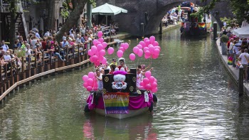 People on Boat With Pink Balloons