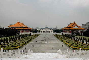 People on Pavement Walking Near Staircase