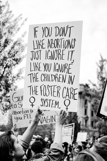 People on Rally Holding If You Don't Like Abortions Signboard