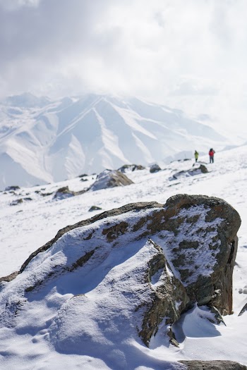 People on Snow Capped Mountain