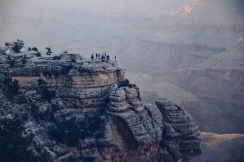 people on top of grey mountain