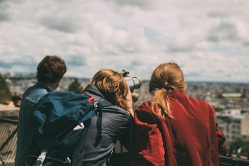 people overlooking the city