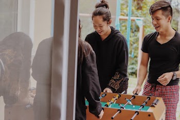 People Playing Foosball Table