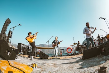 People Playing Instrument on Stage