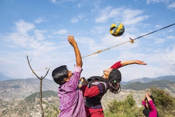 People playing volleyball on mountain, | Free Photo - rawpixel