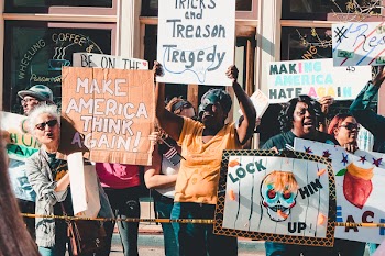 People Rallying in Front of Coffee Shop
