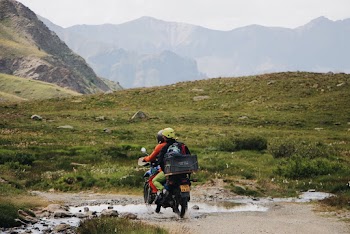 People Riding A Motorcycle