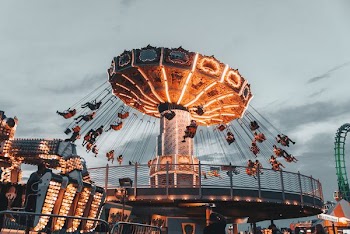 people riding amusement park ride