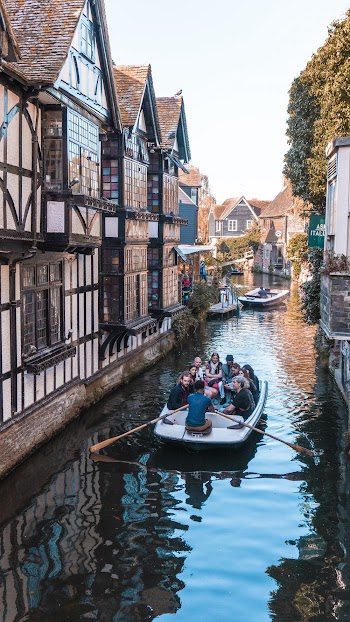 People Riding Boat On River