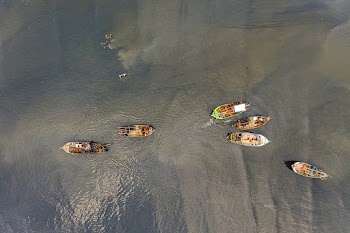 People Riding Boats