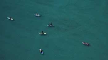 people riding boats