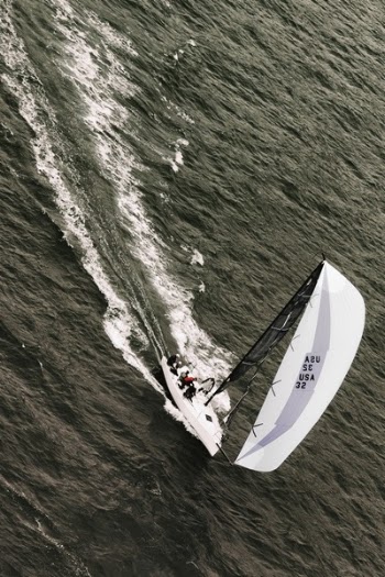 People Riding on White Sailboat on Body of Water