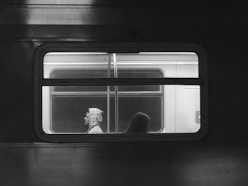 People Riding The Train