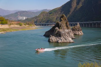 People Riding White Motorboat