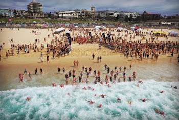 People Running in to the Water