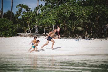 People Running On Beach Shore