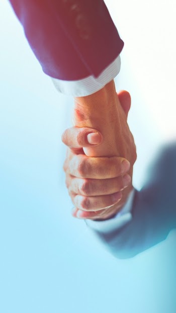 People shaking hands in business agreement