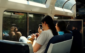 People Sitting Inside A Train