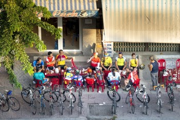 People Sitting Near Bicycles