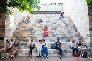People Sitting on Benches Near Park