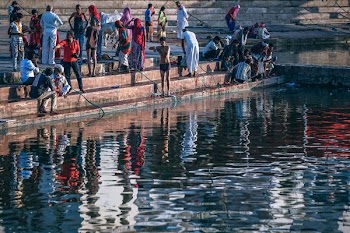 people sitting on concrete stairs