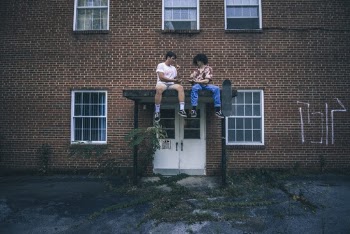 People Sitting On Top Of An Overdoor Canopy