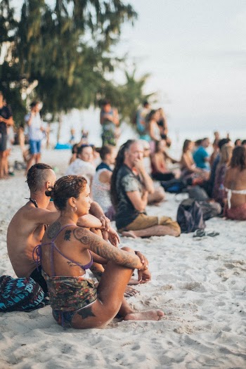 People Sitting on White Sand at Beach