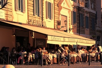 People Sitting Outside Caffetteria during Daytime