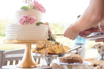 People Slicing Cake