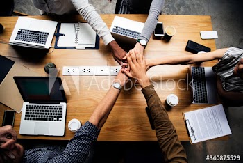 People stacking hands