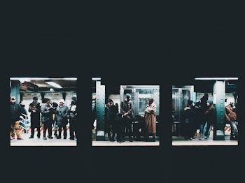people standing and waiting on train station