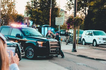 People Standing Beside Black Pickup Truck