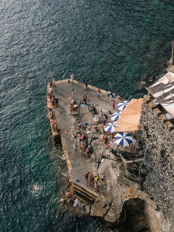 People Standing By The Cliff