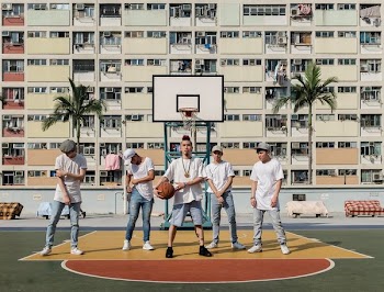 people standing on basketball court