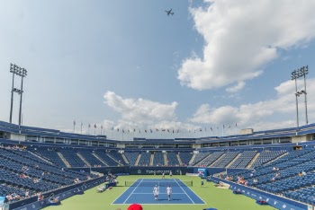 People Standing on Blue and Green Tennis Court