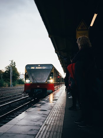 People Standing on Train Station Waiting for Train