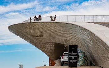 People Standing on White Building