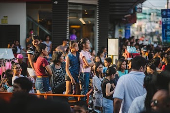 People Standing Outside Buildings