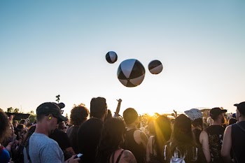 People Standing Under White and Blue Sky