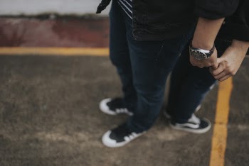 People Standing While Holding Hands